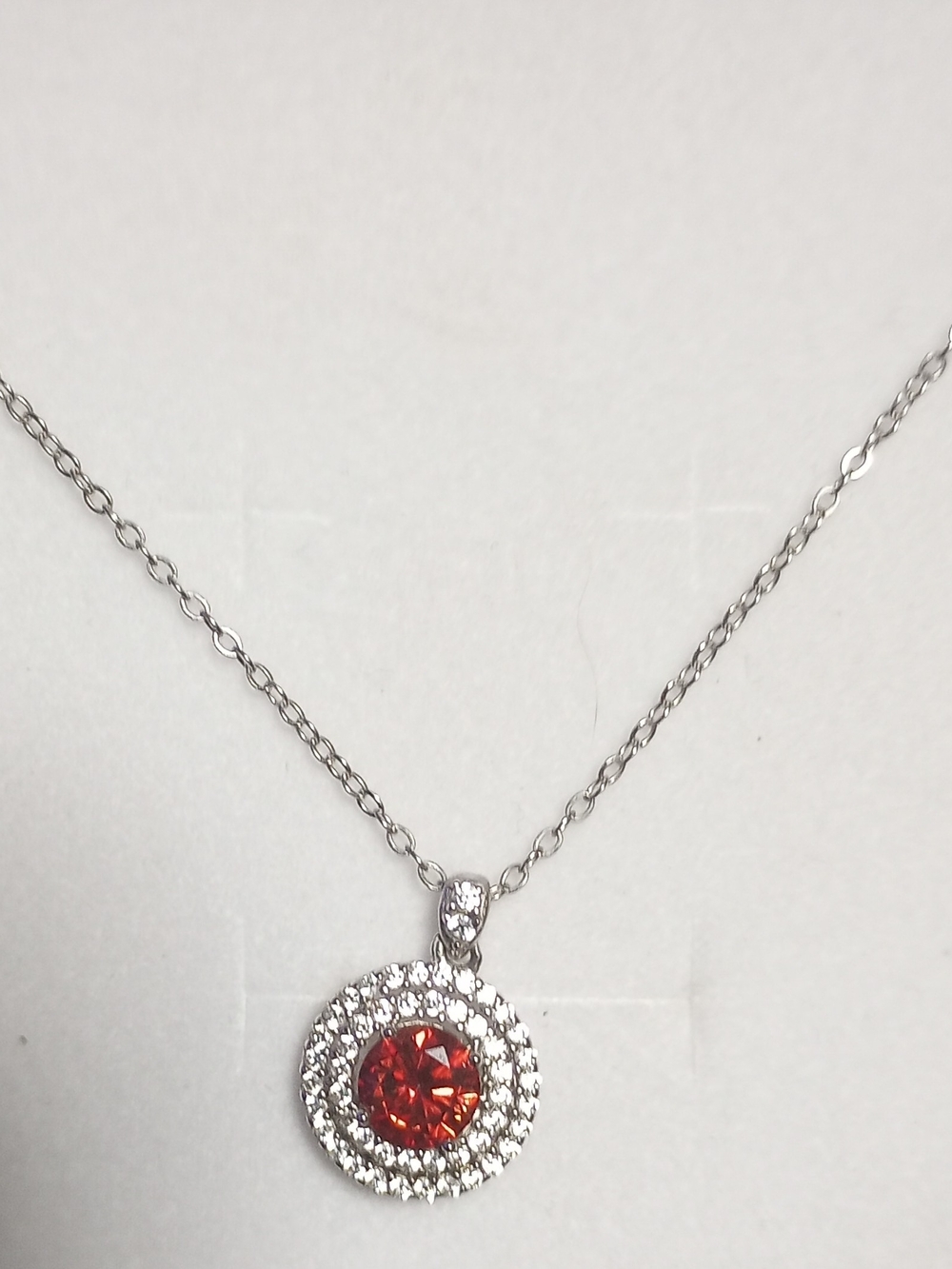 Silver Halo Necklace with Red Crystal Pendant